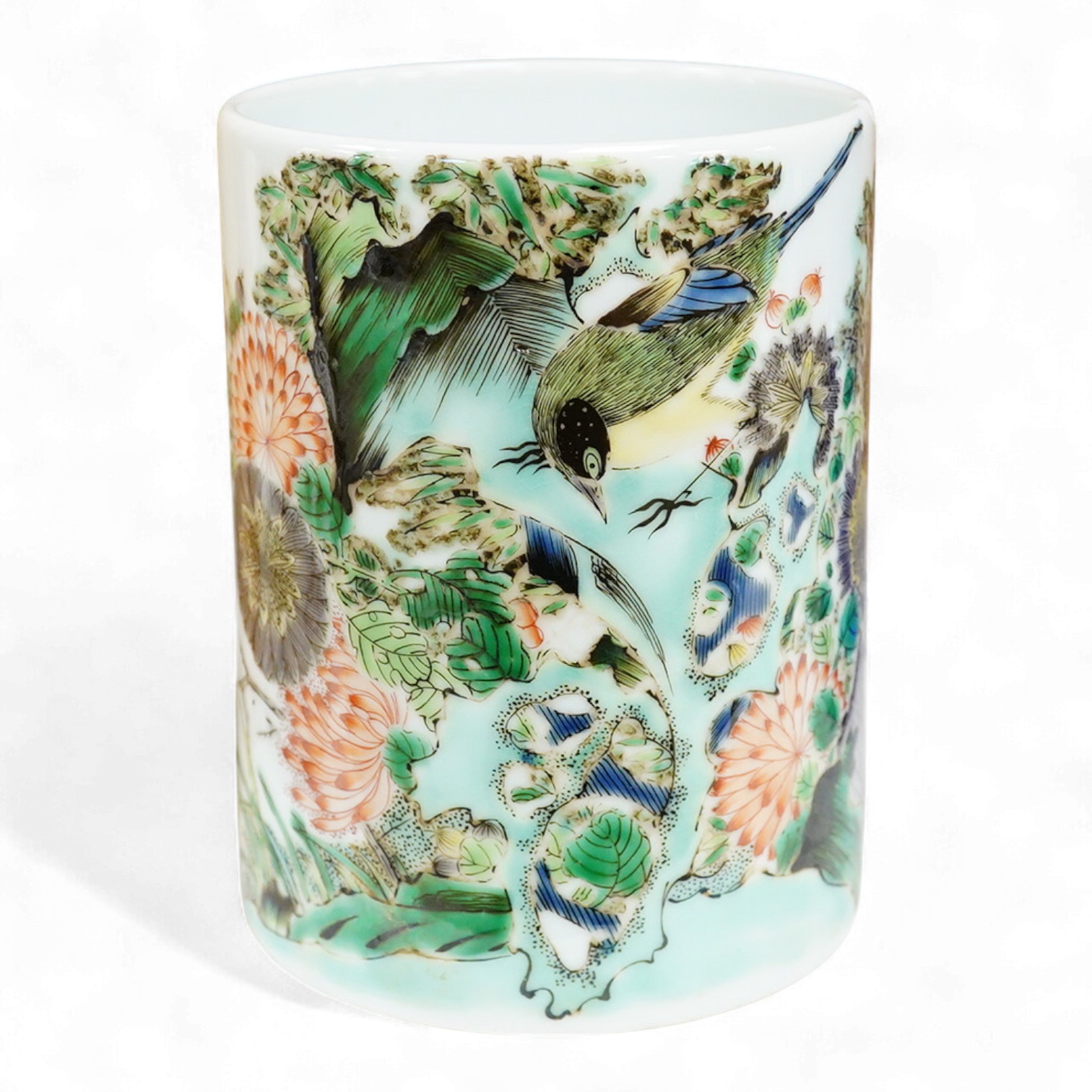 A Chinese famille verte cylindrical brush pot, decorated with birds and flowers, 13cm high